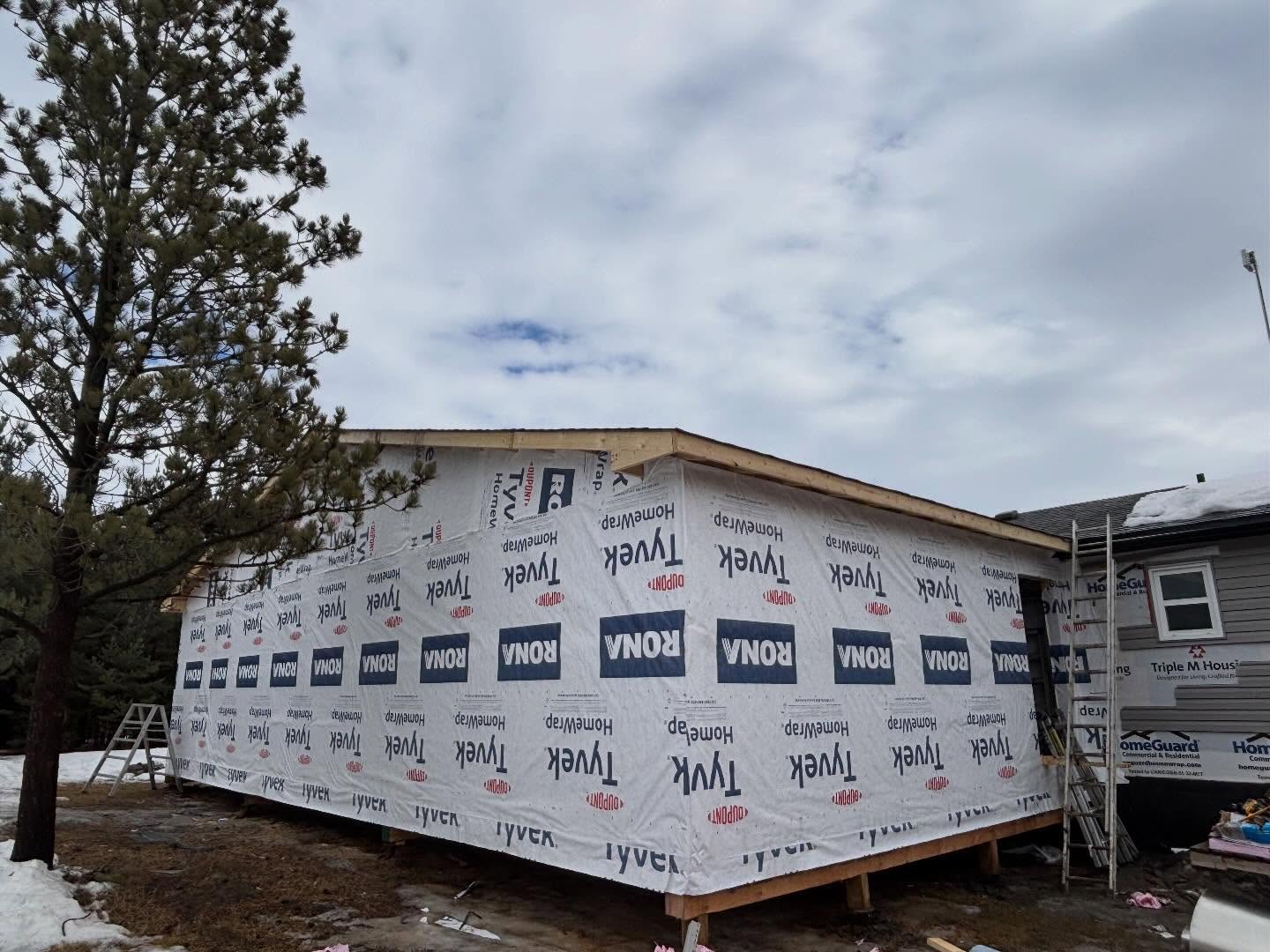 Exterior progress on a home addition project near Edmonton