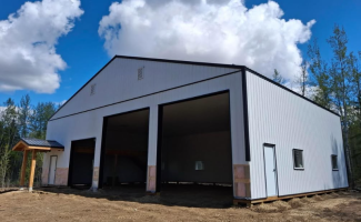 A custom post-frame shop built for practical storage, workspace and long-term use on an Alberta property.