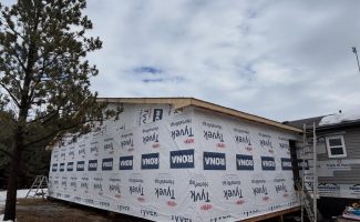 Exterior progress on a home addition project near Edmonton